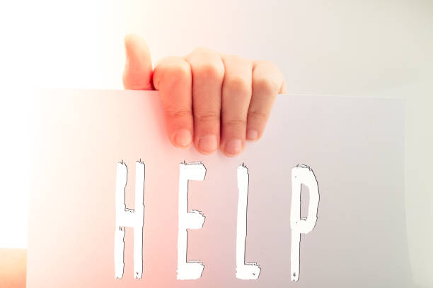 istock Help wording on paper in hand 1152017858