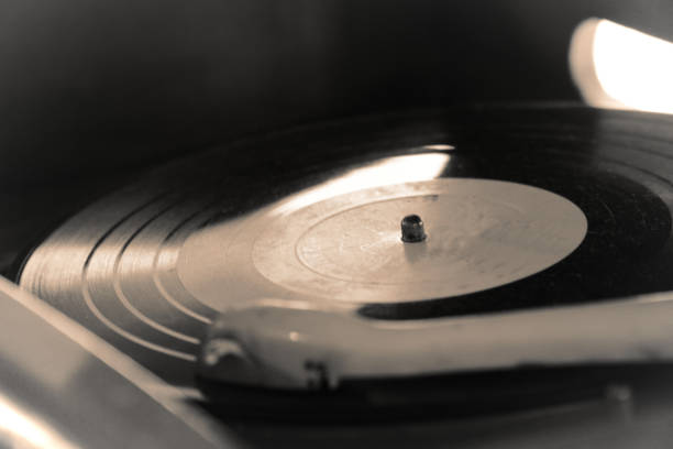 istock Turntable, Old record player stylus on a rotating disc, vintage filtered, selective focus 1152019471