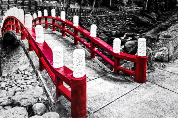 black and white forest with red bridge, Wulai, Taiwan.