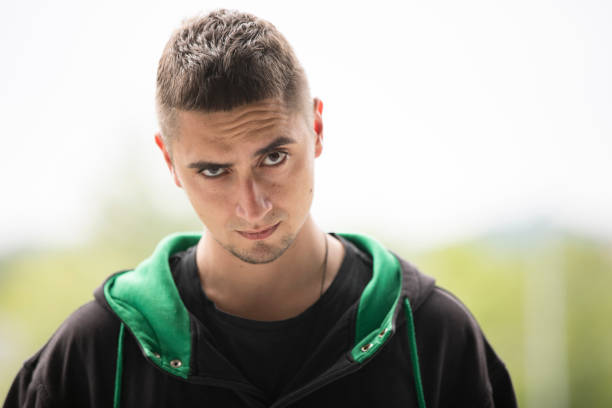 Young Adult Man With Doubtful Face.