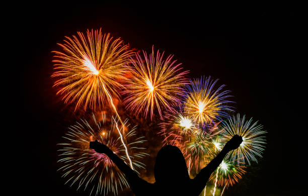 istock Celebration Happy woman watching beautiful fireworks holiday. - Image 1152020538