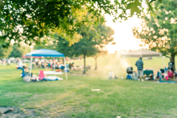 istock Blurry background people enjoy BBQ and camping in local park at sunset 1152020791