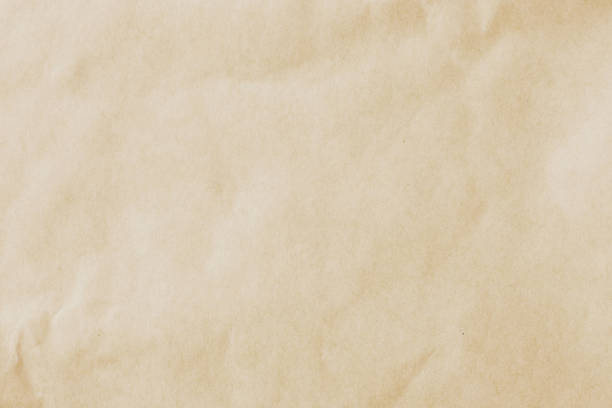istock Old paper cardboard texture. Yellow background Close up 1152021752