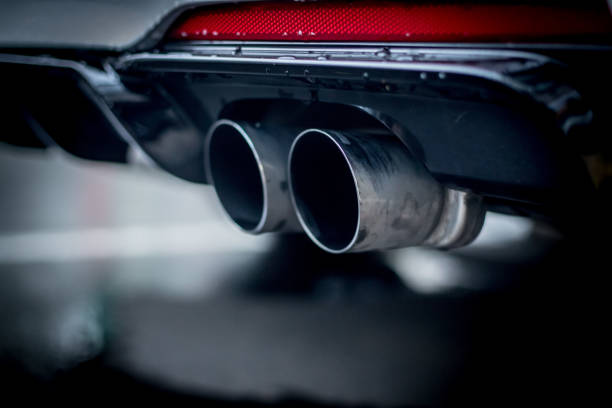 istock Powerful car with exhaust pipe, pollution and fine dust 1152021942