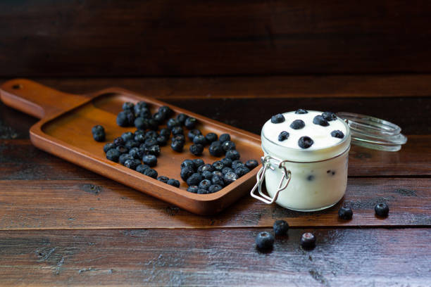 istock Blueberries in fresh organic yogurt in glass 1152022108
