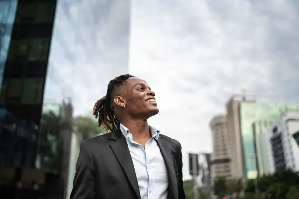 Businessman contemplating the sky