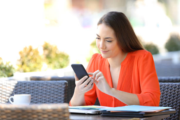 istock Serious entrepreneur browsing smart phone in a bar terrace 1152023508