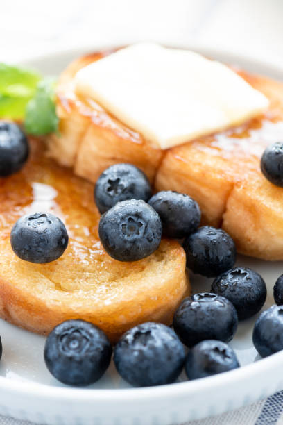 French toast with blueberries, honey and butter