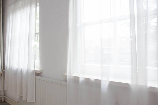 istock White net curtain against two windows in a house, 1152024782