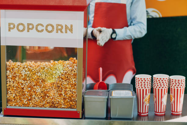 Seller and tray cart with popcorn stock photo