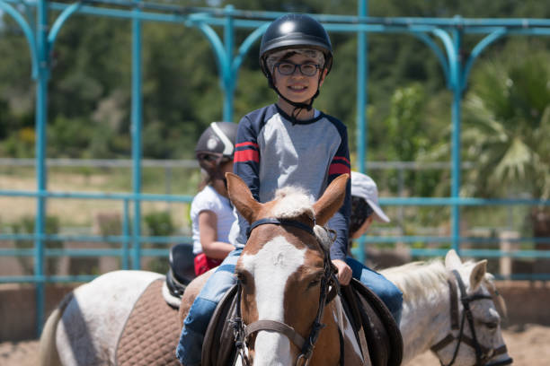 istock Child Riding Horse Outdoors 1152024913
