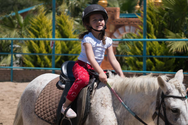 istock Beautiful child on a horse 1152024954
