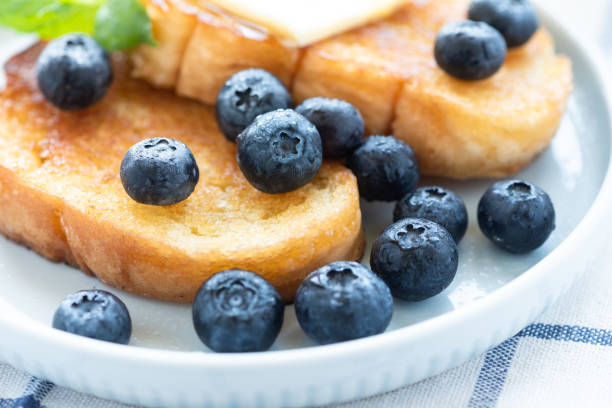 French toast with blueberries, honey and butter
