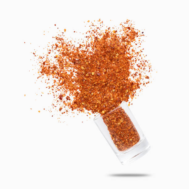 istock Glass jar with chili pepper flying on white background 1152026100
