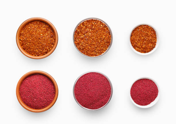 istock Different sized bowls with chili pepper and sumac on white 1152026139