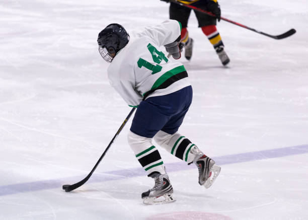 istock Mature woman playing hockey 1152026260