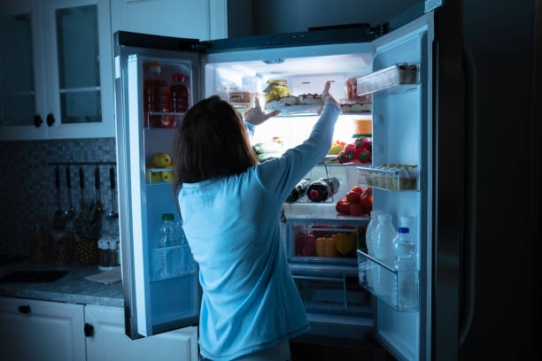 istock Woman Keeping Food In Refrigerator 1152026584