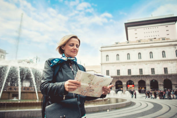 istock Tourist woman with map on Piazza De Ferrari 1152027771