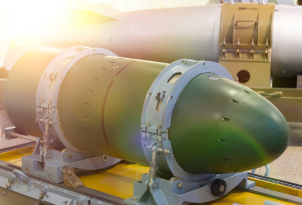 istock A warhead on a transport stand, against a rocket. 1152029619