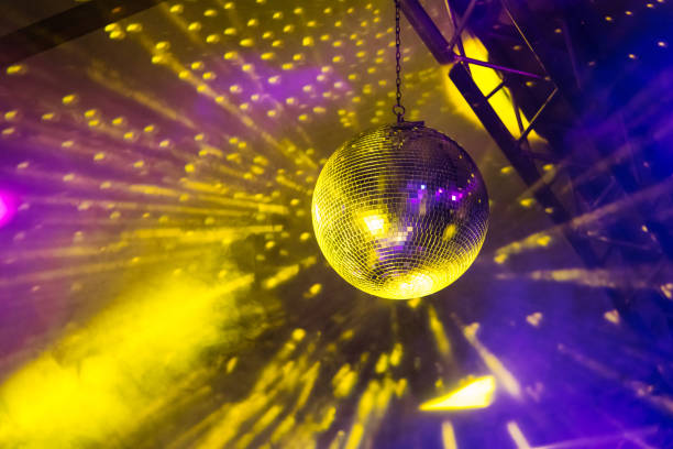 istock Shiny disco ball with lightning effects on stage 1152029950