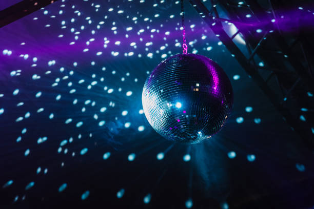 Shiny disco ball with lightning effects on stage stock photo