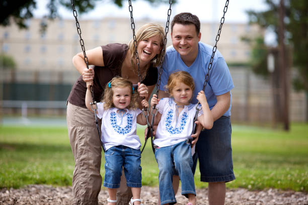 istock summer young family park swings 115203003