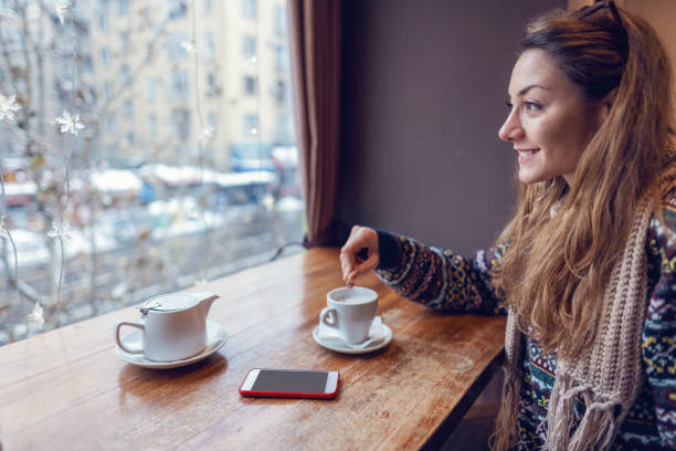 istock Woman drinking hot tea at the teashop 1152031831