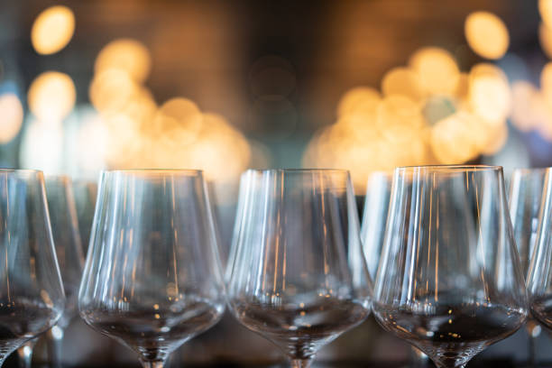 istock Wine glasses in restaurant with lights blurred background 1152032053
