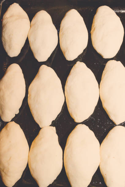 istock Freshly made pies lie on a baking sheet before cooking 1152033097