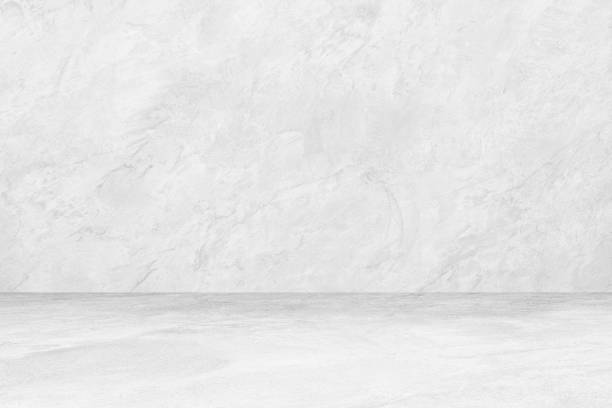 istock White Cement Wall Grunge Background , Closeup Grunge Texture White Paint Concrete Wall design background 1152034688
