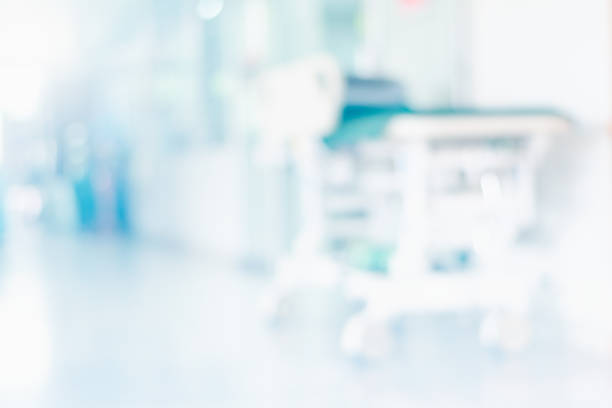 istock Abstract blurred hospital corridor with patient bed Background From Building Hallway for hospital building banner background 1152034737