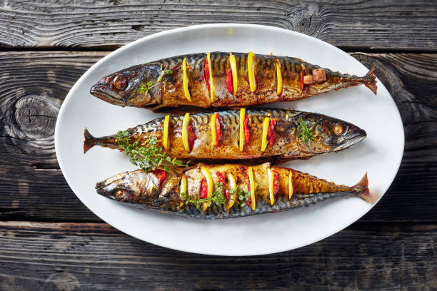 istock three whole grilled mackerel with lemon, tomatoes, mushrooms, spices and herbs. 1152035559