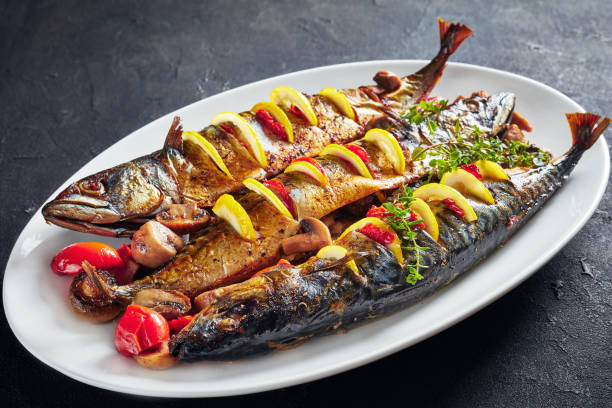 istock three whole grilled mackerel with lemon, tomatoes, mushrooms, spices and herbs. 1152035562