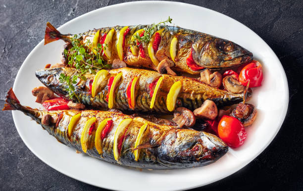 istock three whole grilled mackerel with lemon, tomatoes, mushrooms, spices and herbs. 1152035566