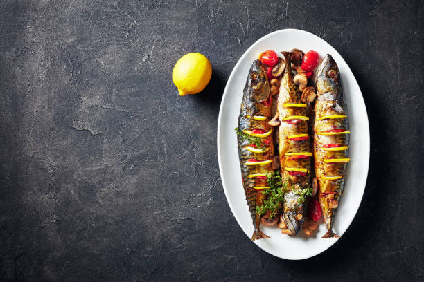 istock three whole grilled mackerel with lemon, tomatoes, mushrooms, spices and herbs. 1152035609