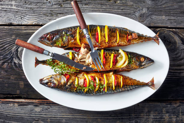istock three whole grilled mackerel with lemon, tomatoes, mushrooms, spices and herbs. 1152035625