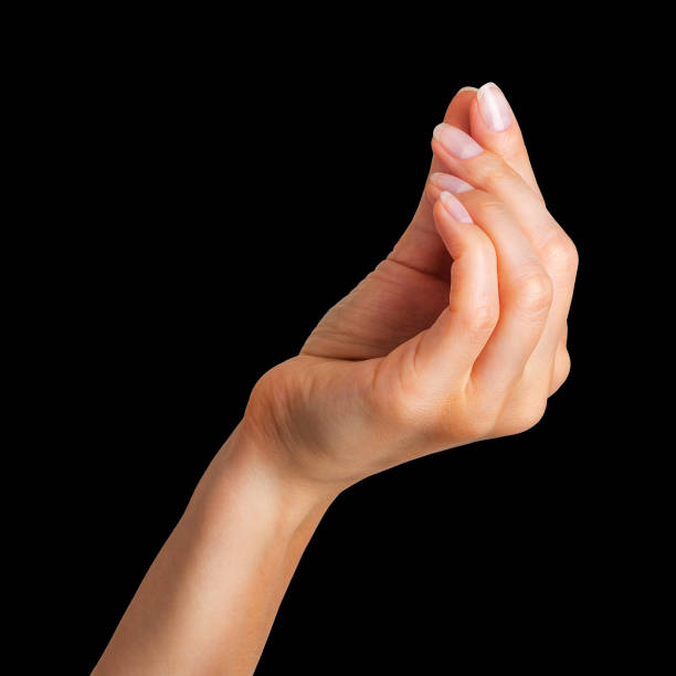 mujer mano sosteniendo algo poco con dos dedos - pinching fotografías e imágenes de stock