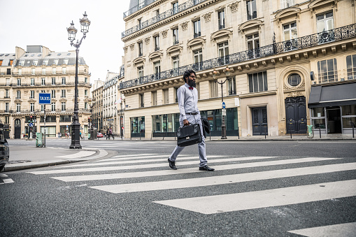 Man commuting to work in the city of Paris