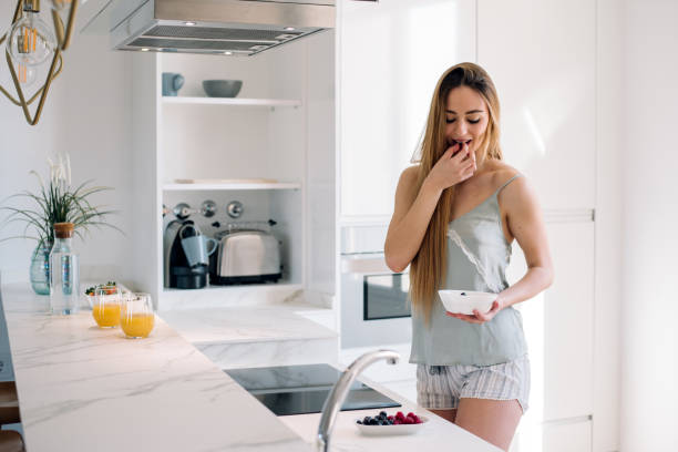 istock Woman having breakfast at home 1152037222
