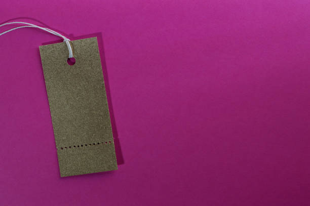 istock gold rectangle paper tag on pink background 1152038494