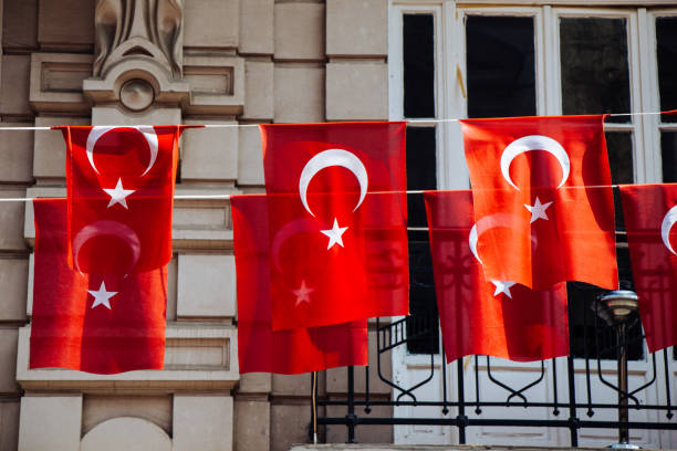 istock Turkish national flags with white star and moon in sky 1152040622