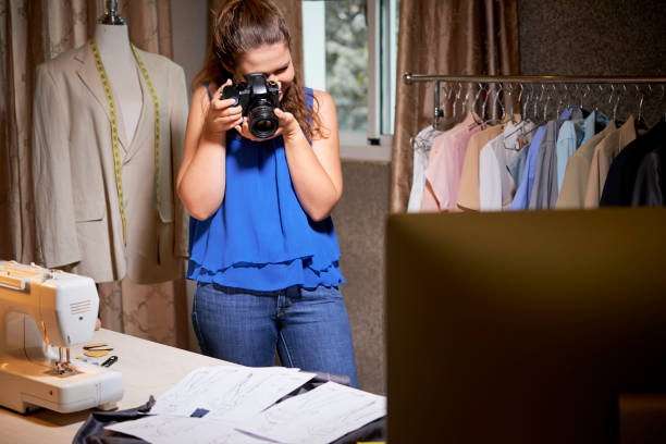 istock Taking photo of sketches for website 1152041395