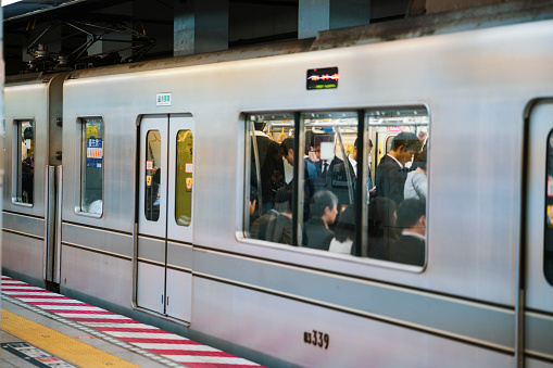 Tokyo, Japan - May 07, 2019: Commuters inside subway train during rush hour