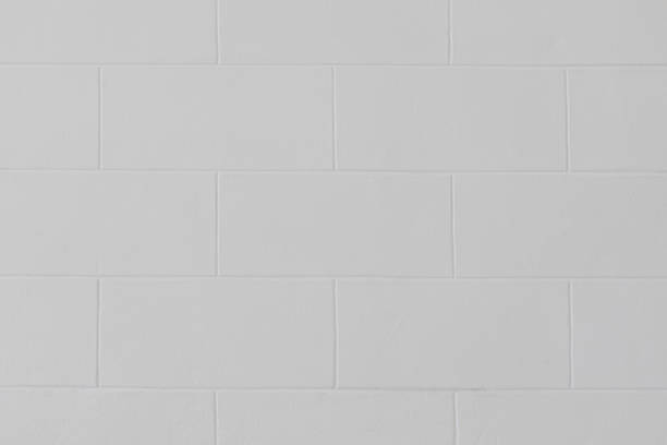 istock Close up of modern white block brick wall or floor texture background. 1152042072
