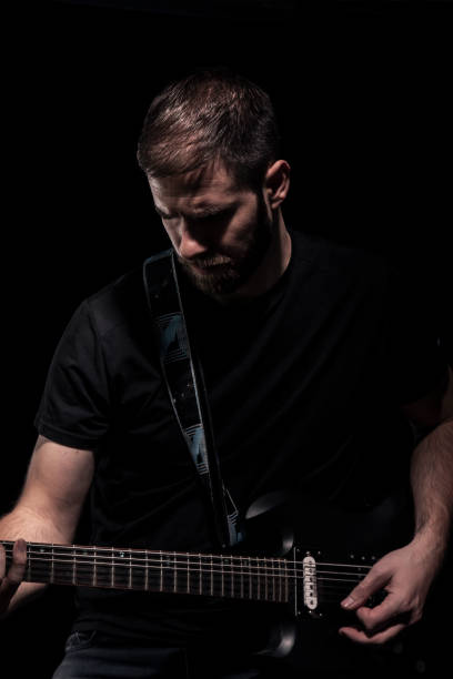 istock one man, playing guitar, rock musician. 1152043173