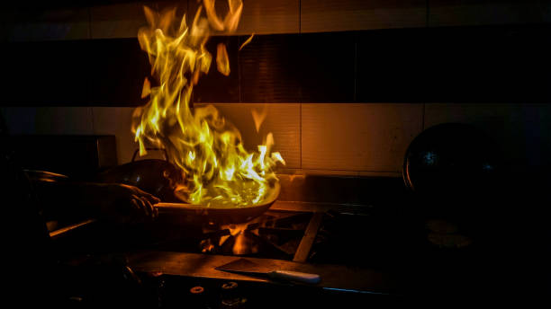 istock Fire coming out of a frying pan in a kitchen 1152043385