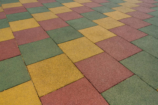 istock Colored rubber square paving slab for playgrounds close-up. 1152043826