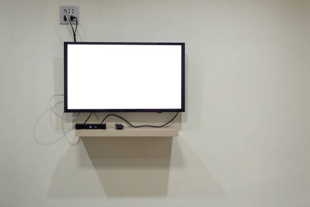 istock Blank TV display on the wall and cable connection 1152044646