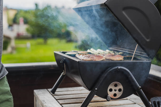 istock Smoker BBQ filled with meat and vegetables 1152046695