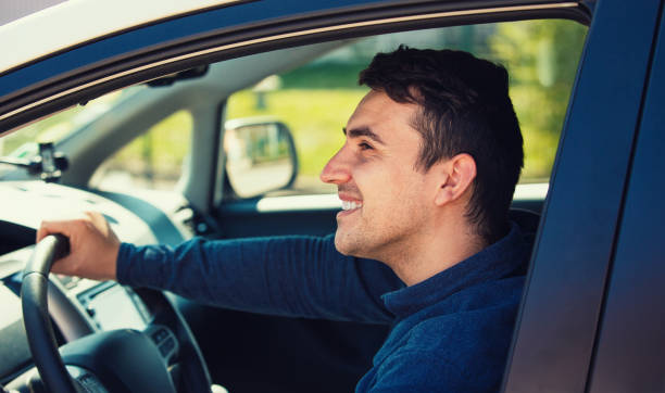 istock Successful guy confident smiling, enjoying the ride, traveling road trip concept. 1152047209
